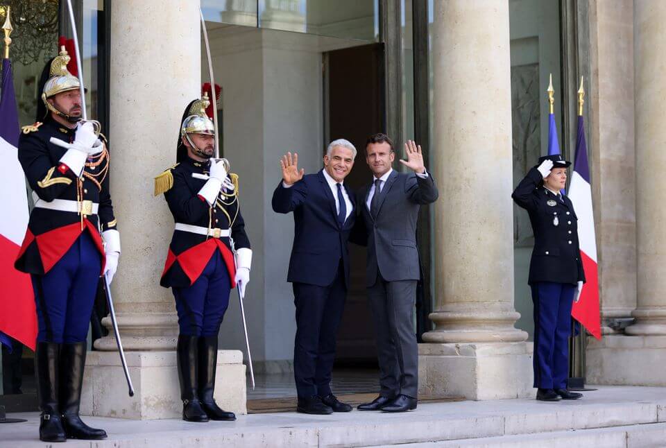 The World Must Respond to Iran’s Nuclear Threat, Lapid Tells Macron