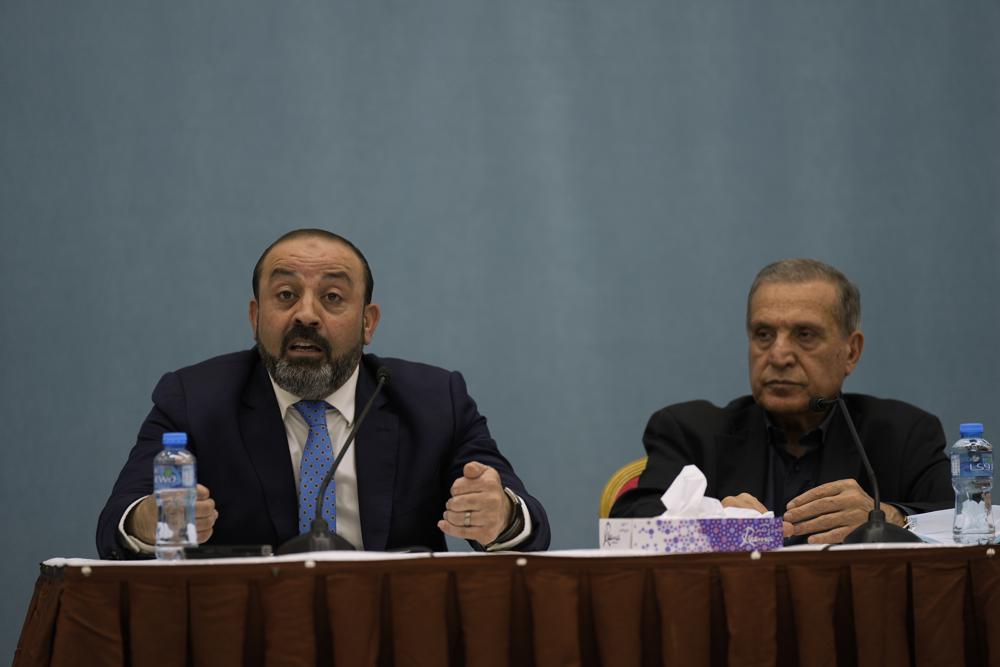 Palestinian Attorney General Akram al-Khatib (L) announces the results of the Palestinian investigation into the death of Palestinian-American Al-Jazeera journalist Shireen Abu Akleh