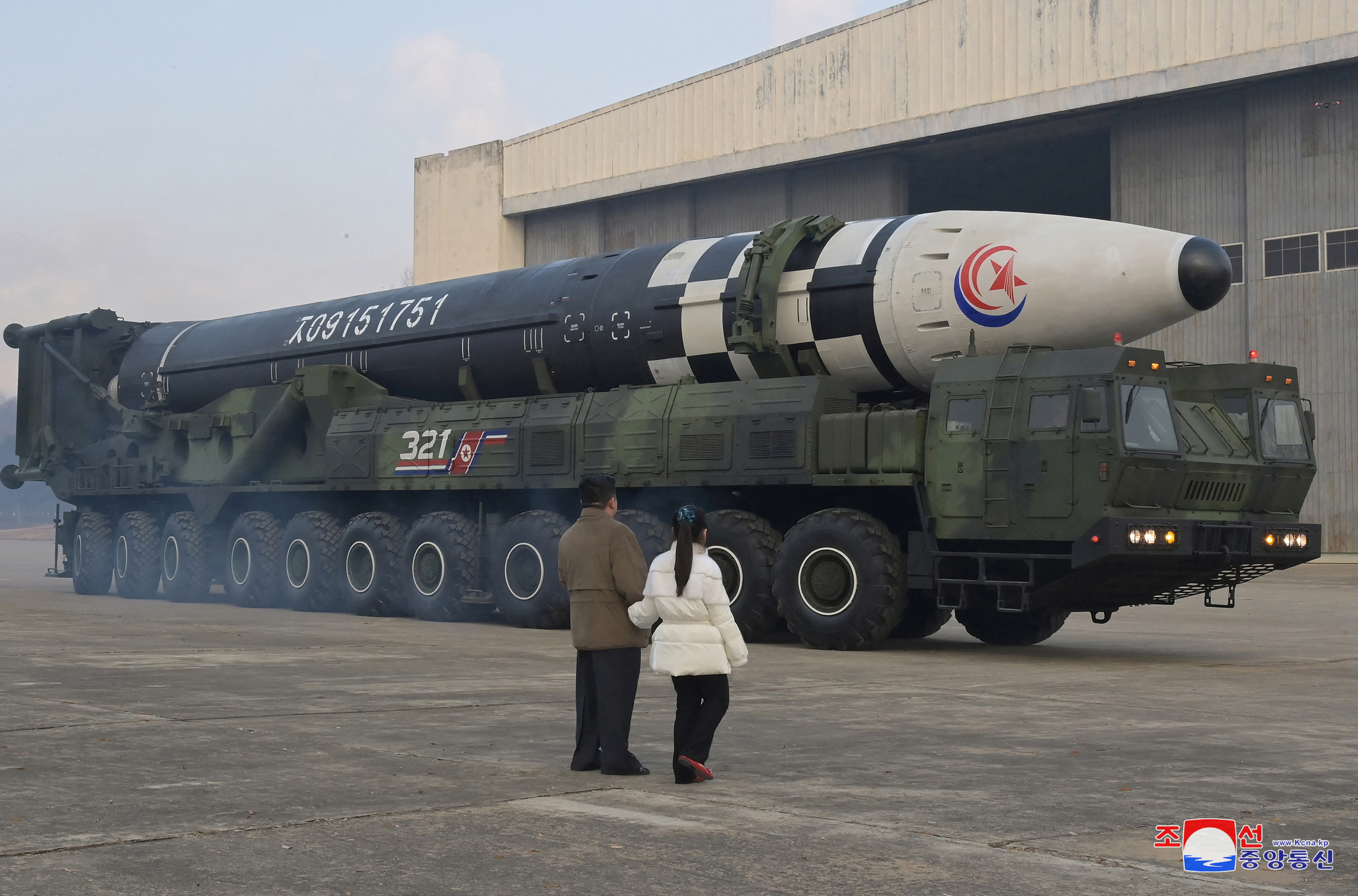North Korean leader Kim Jong Un, along with his daughter, inspects an intercontinental ballistic missile in this undated photo released on November 19, 2022.