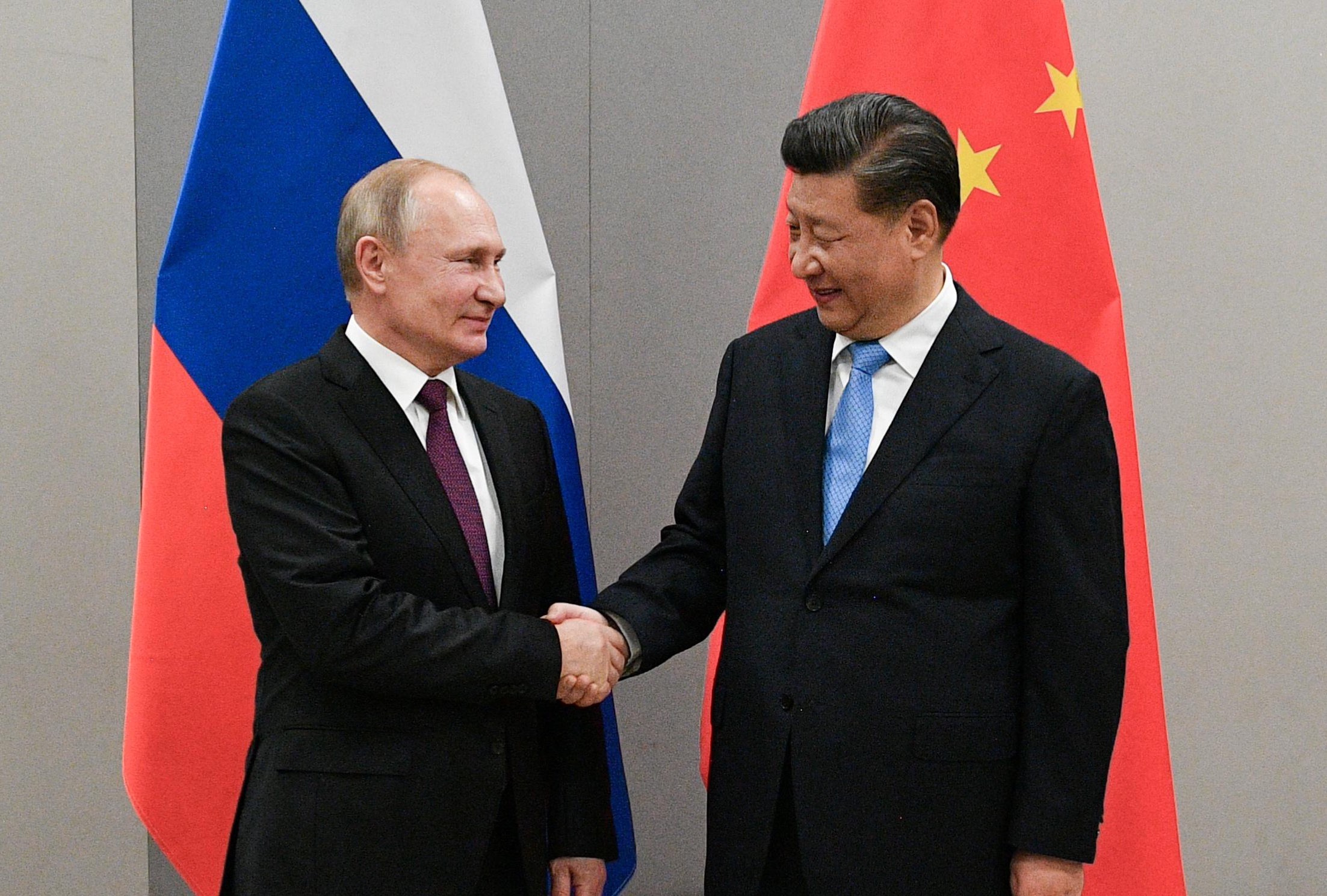 Russian President Vladimir Putin (L) and Chinese President Xi Jinping IMAGE SOURCE: REUTERS