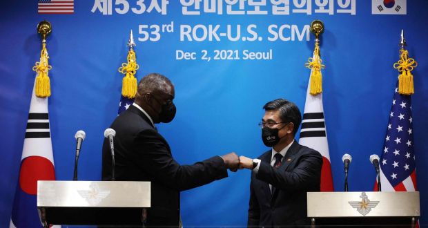 US defence secretary Lloyd Austin (L) bumps fists with South Korean Defence Minister Suh Wook after a news conference in Seoul on Thursday.